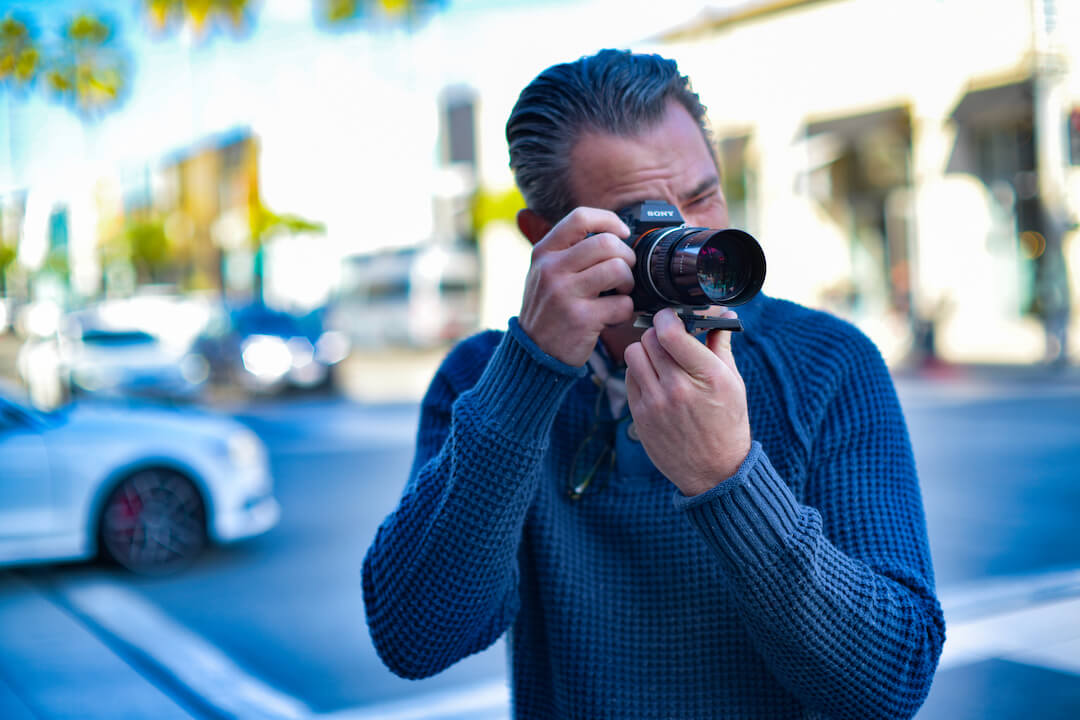 Private Investigator Ken Childs using camera